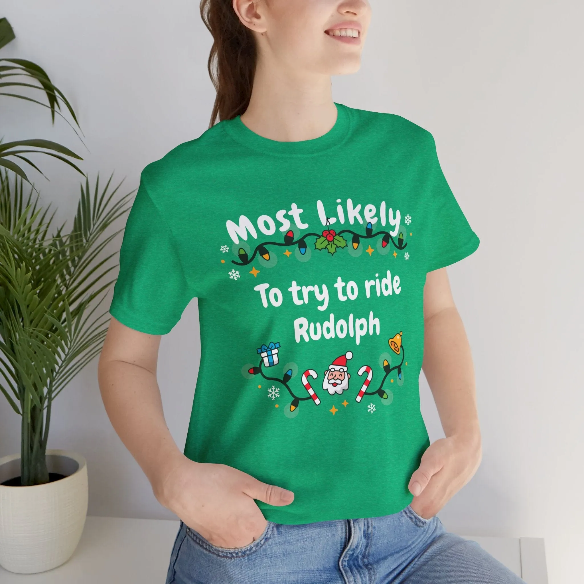 Most Likely To try To Ride Rudolph Unisex Deluxe Tee