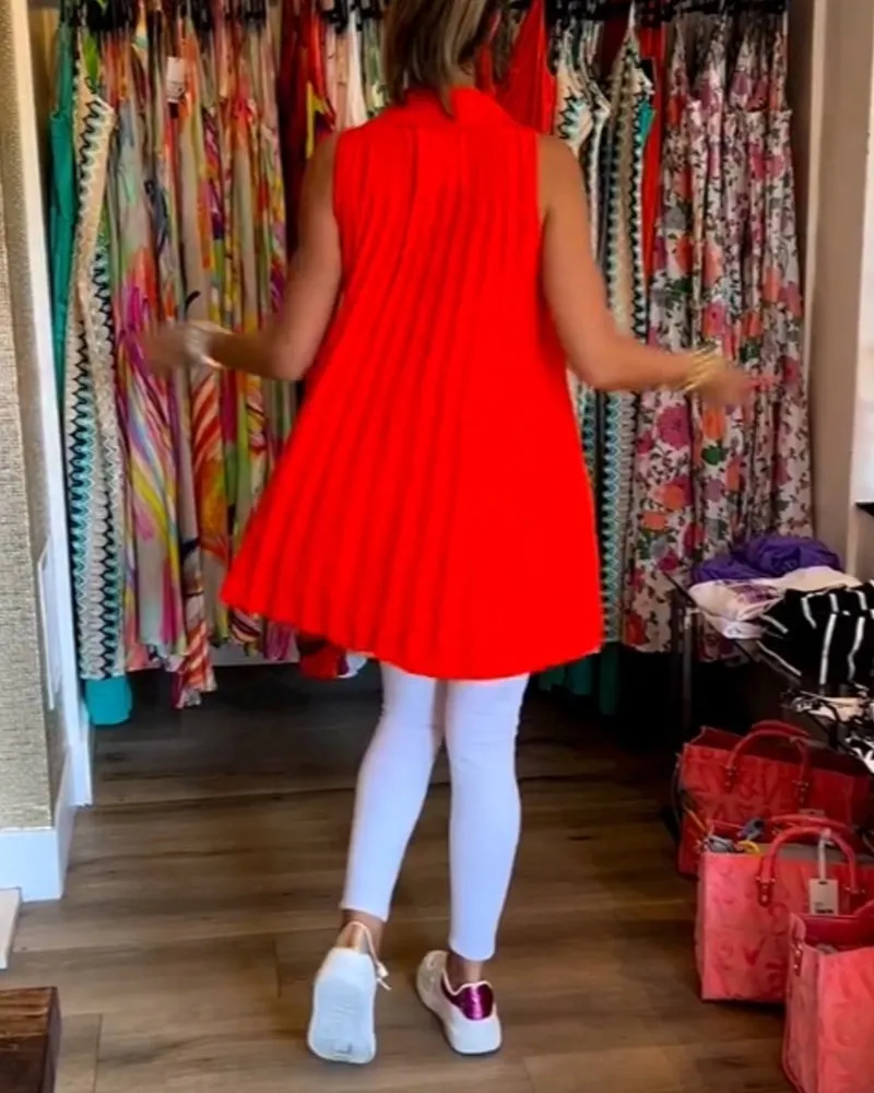 Veronika | Sleeveless top with ruffles and turn-ups